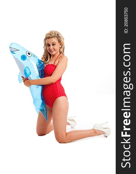 Image showing pretty female in red swimsuit and inflatable isolated against white. Image showing pretty female in red swimsuit and inflatable isolated against white