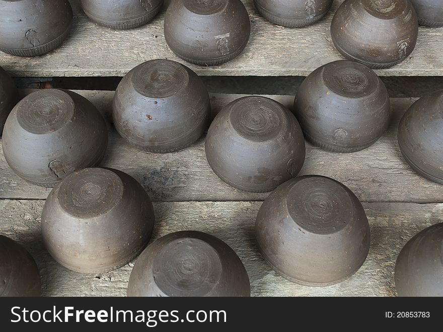 Pile of black pottery in a factory in Bangkok, Thailand