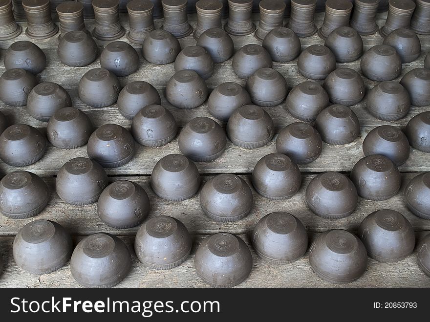 Pile of black pottery in a factory in Bangkok, Thailand