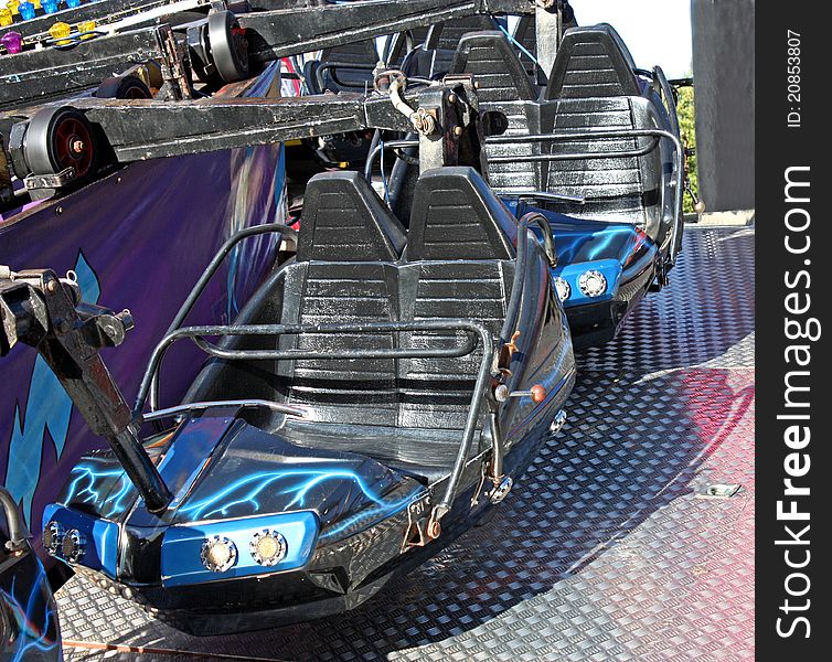 The Seats of a Fast Running Fun Fair Ride.