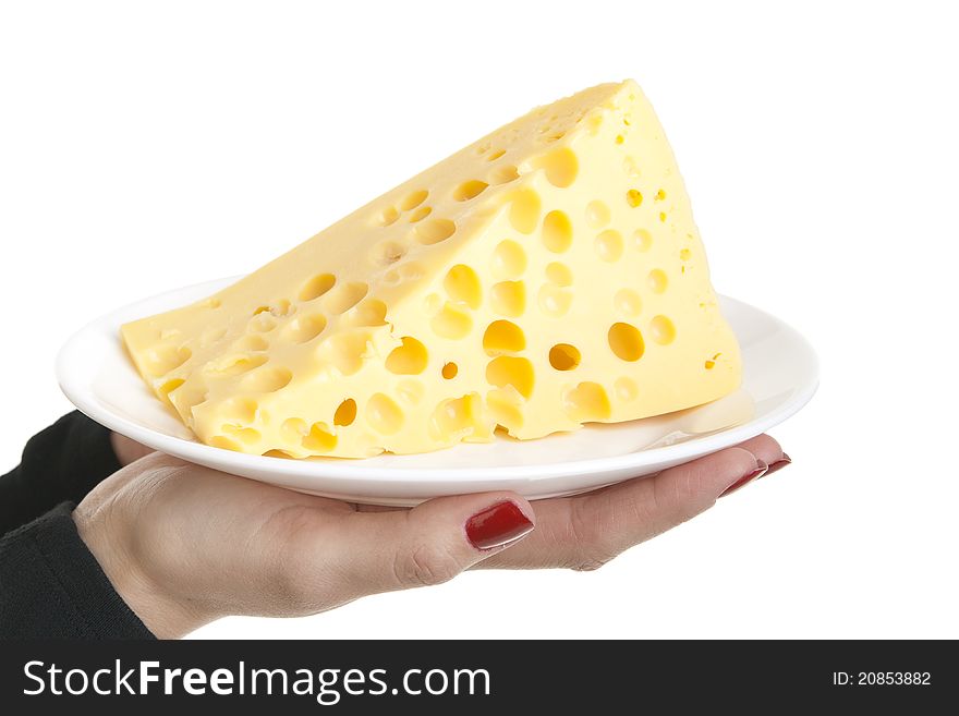Slice of cheese on a plate, in the hands of a girl. Slice of cheese on a plate, in the hands of a girl