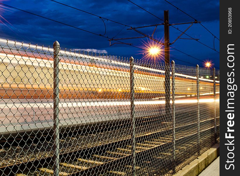 Denver Colorado's Municipal Light Rail Speeding southbound on Interstate 25. Denver Colorado's Municipal Light Rail Speeding southbound on Interstate 25.