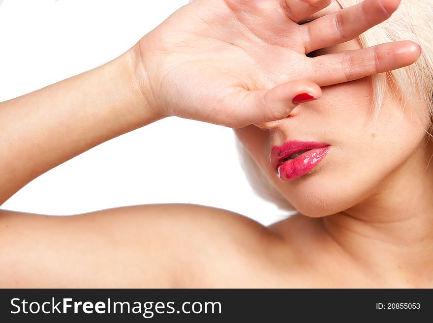 Girl is closing an eye a hand, lips dyed pink lipstick