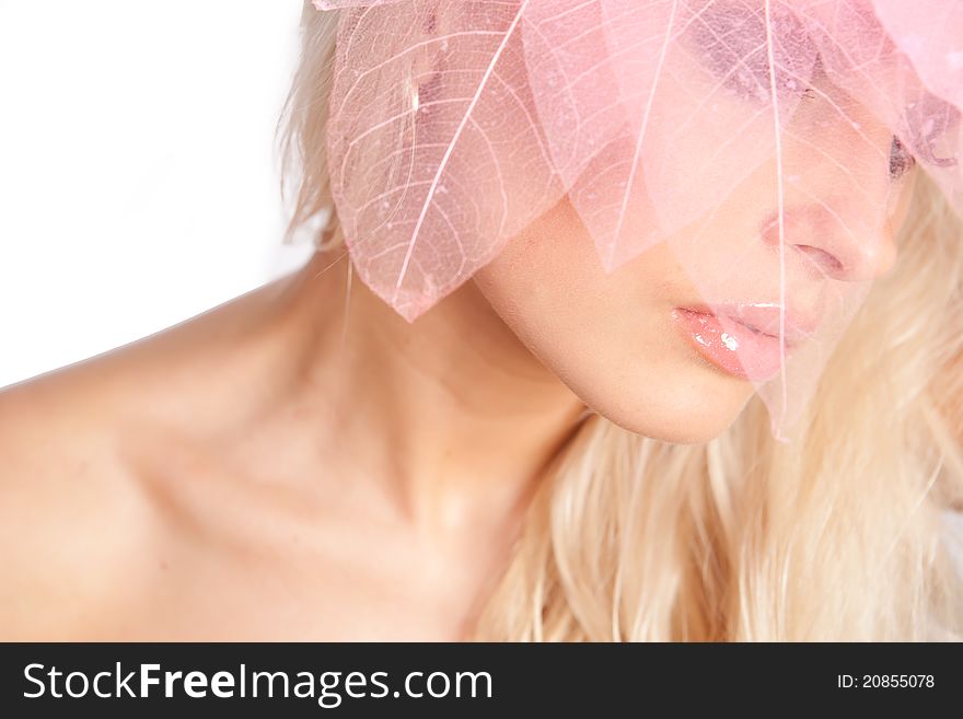 Close-up face. Pink lips. decorative pink tree leaves