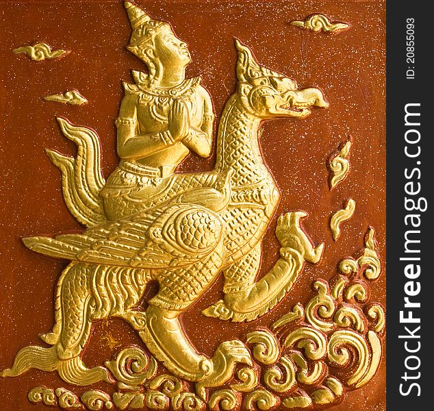 The Angle sit on a swan fly on the sky in traditional Thai style molding art.