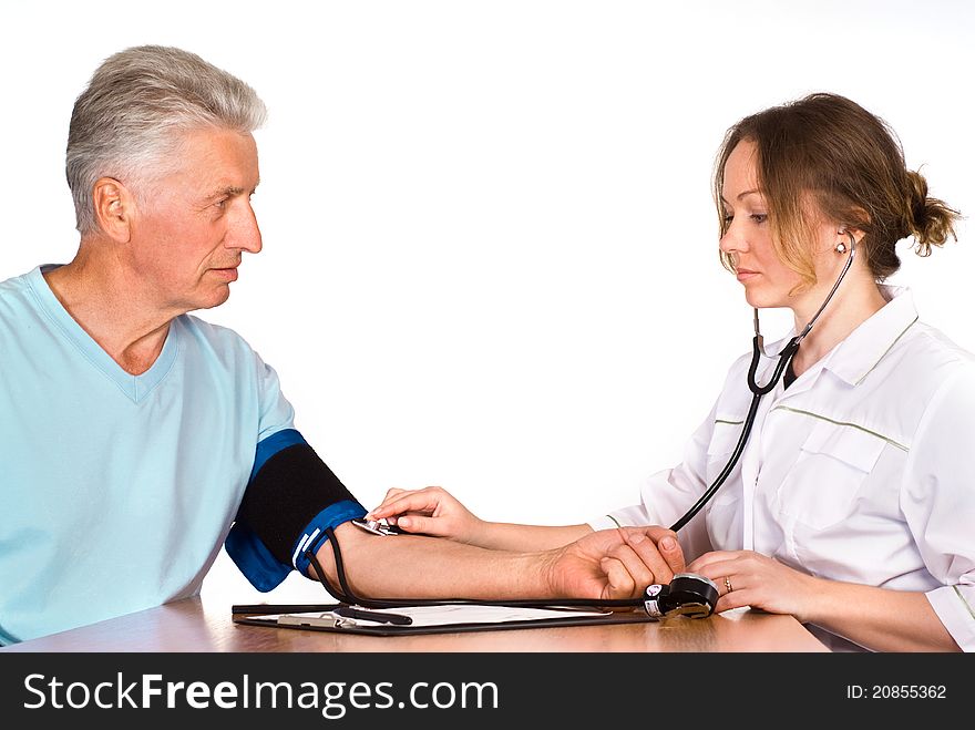 Old man with nurse sit at table on white. Old man with nurse sit at table on white