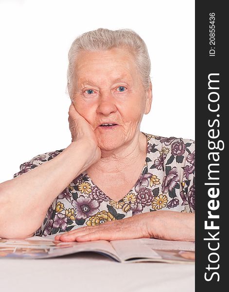 Portrait of an old woman reading a book