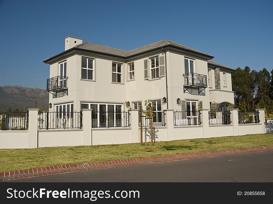 Exterior of a luxury house on a sunny day. Exterior of a luxury house on a sunny day