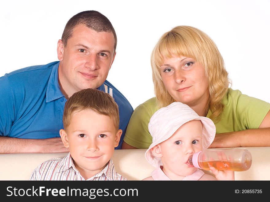 Portrait of a cute family on a sofa. Portrait of a cute family on a sofa