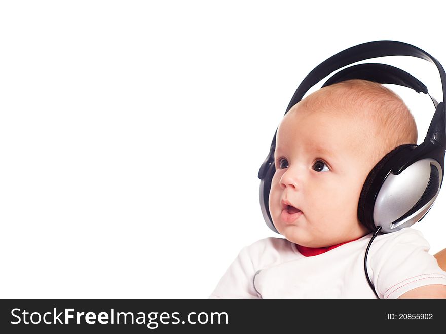 Cute little baby with headphones on white