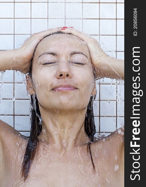 Attractive woman taking a shower