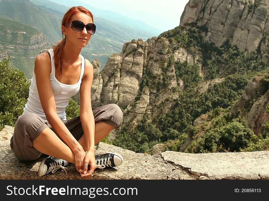 Cute young woman relaxing outdoors. Cute young woman relaxing outdoors
