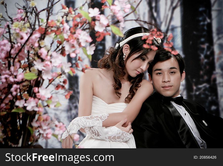 Portrait of young couple in romantic action with foreground