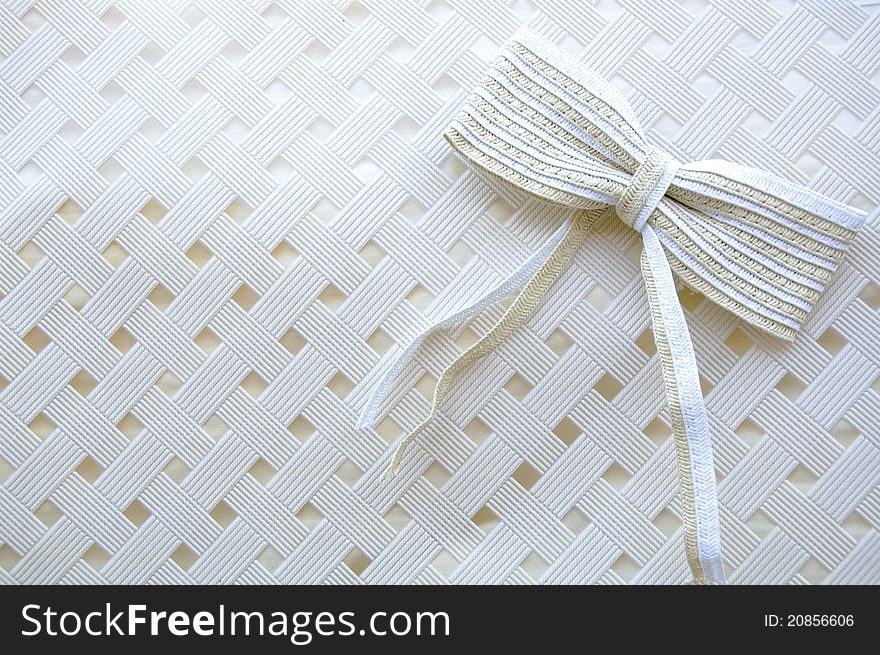 Handmade bow on white texture background