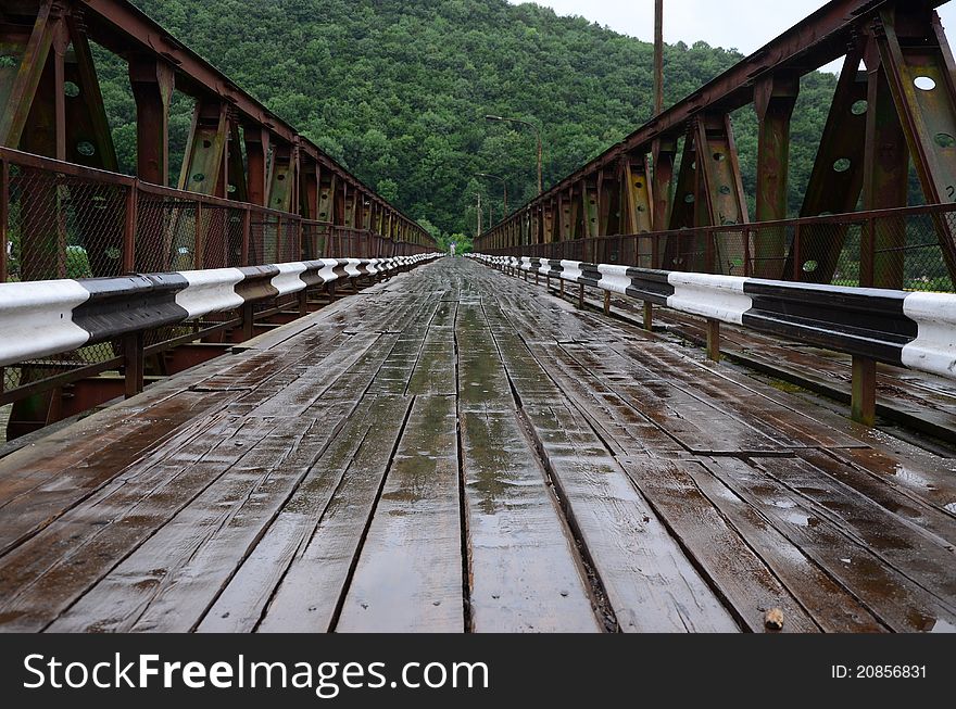 Outdated wooden bridge over the river. Outdated wooden bridge over the river