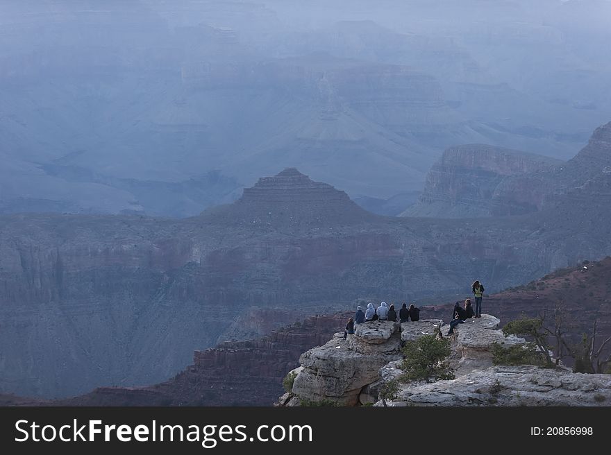 Tourists waiting to watch the sunrise at Yavapai Point, Grand Canyon. Tourists waiting to watch the sunrise at Yavapai Point, Grand Canyon