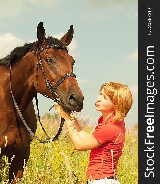 Kissing  Of Young  Girl With Your  Horse In Field