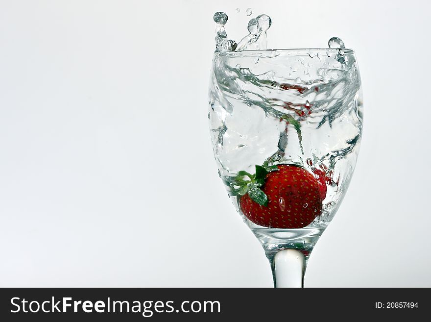 A Fresh Look of combination between fresh strawberry and a glass of water. A Fresh Look of combination between fresh strawberry and a glass of water