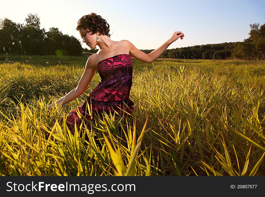 Beautiful Girl In Dress On Field