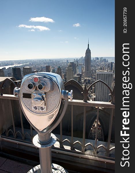 Tourist binoculars overlooking the Manhattan skyline in New York City, USA, United States of America. Tourist binoculars overlooking the Manhattan skyline in New York City, USA, United States of America