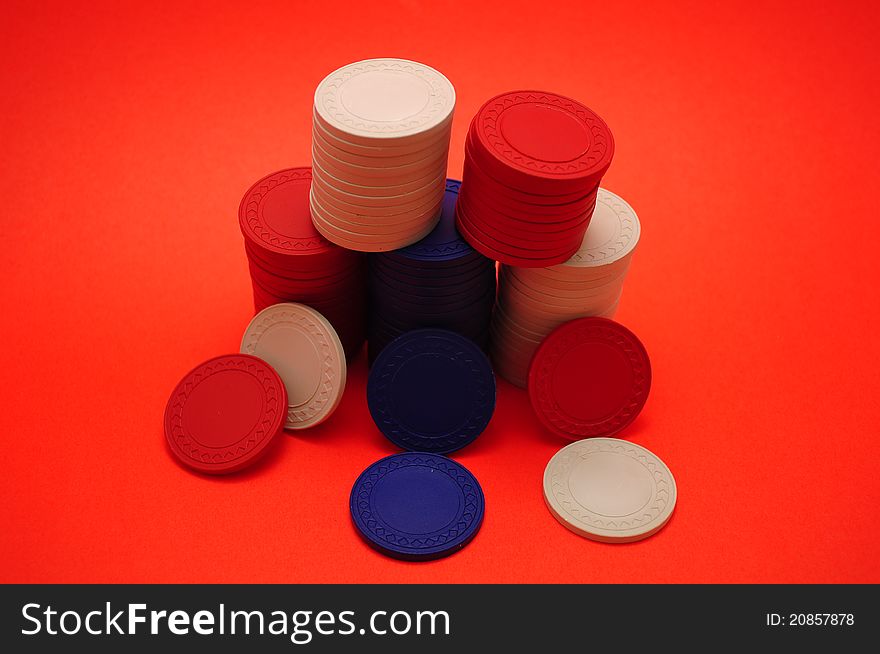 Poker Chips on Red Background. Poker Chips on Red Background