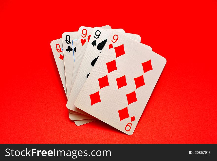 Winning Hand called Full House in Poker on Red Background.