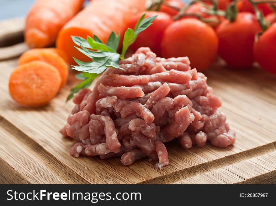 Minced meat on chopping board