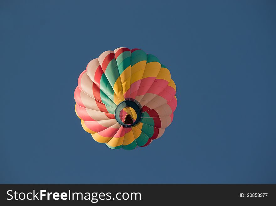 Image of a swirl colored balloon passing right over head. Image of a swirl colored balloon passing right over head