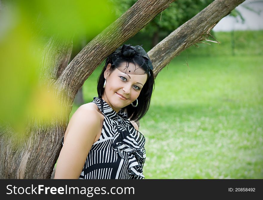 The girl on a grass at lake