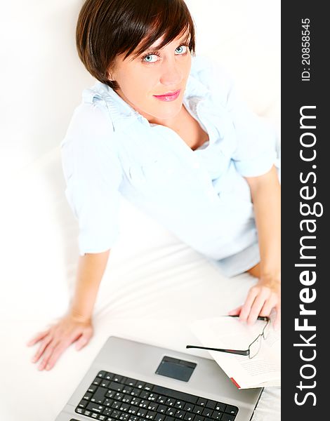 Beautiful girl with book and laptop and spectacles