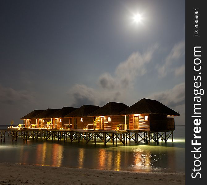 Water Villas in The Ocean under moonlight.. Evening Paradise. Maldives. Water Villas in The Ocean under moonlight.. Evening Paradise. Maldives.