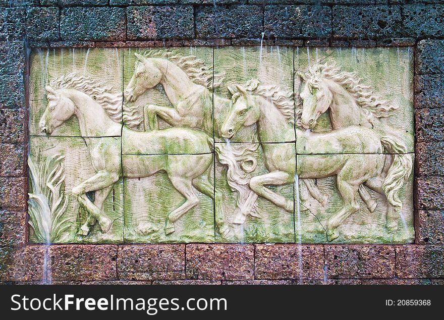 Horses in low relief statue