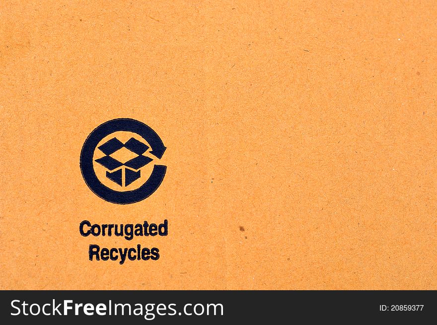 Closeup of a recycle label on a cardboard box