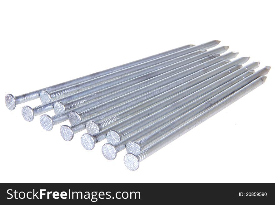 The group of steel nails lying on a white isolated background