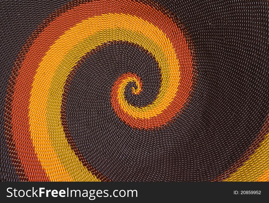 Close up photo of hand-made plaited plate as a background. Close up photo of hand-made plaited plate as a background