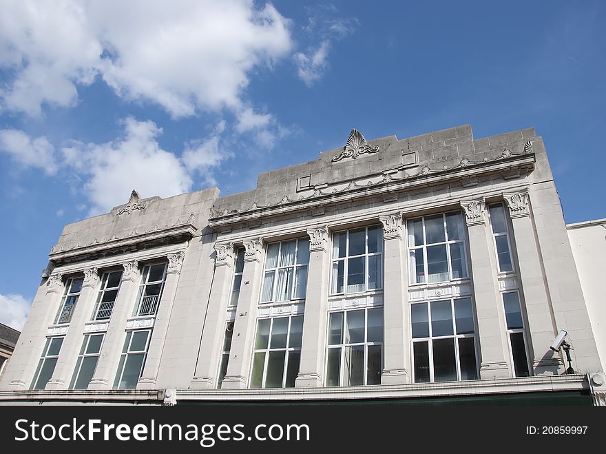 The Frontage of an Art Deco Building under a blue summer sky. The Frontage of an Art Deco Building under a blue summer sky