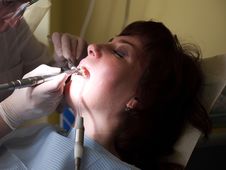 Female Patient At The Dentist Stock Image