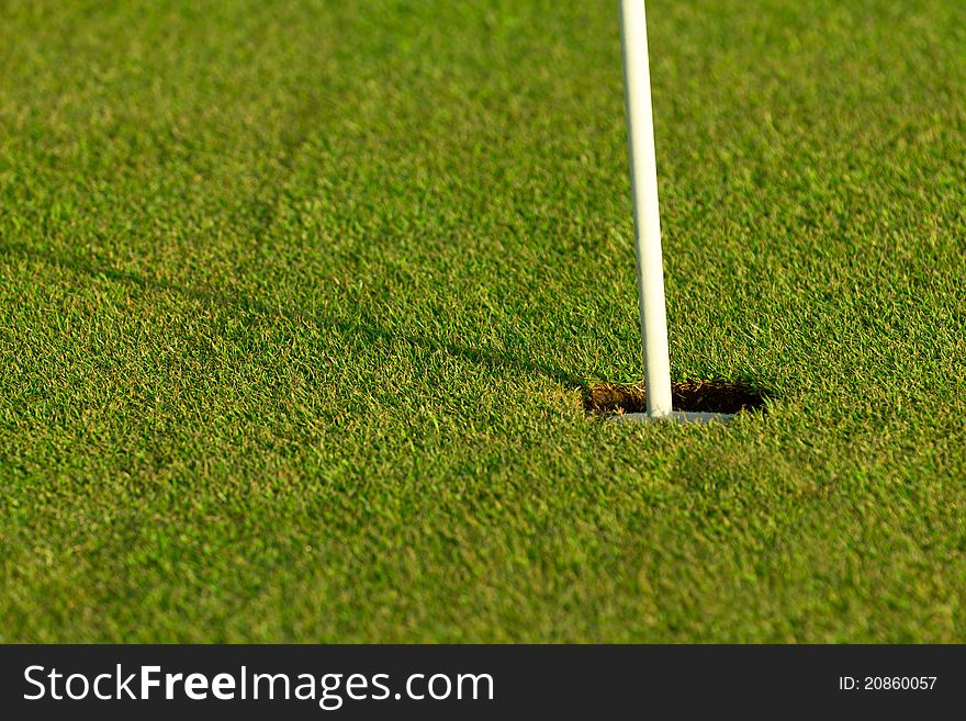 Detail of a golf hole with shadow