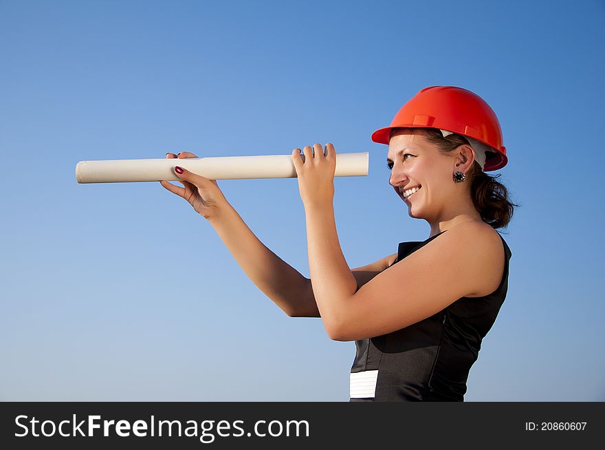 Business woman фтв construction plans, blue sky background