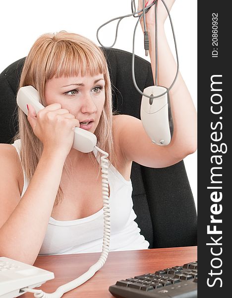 Woman holding a mouse and talking on the phone