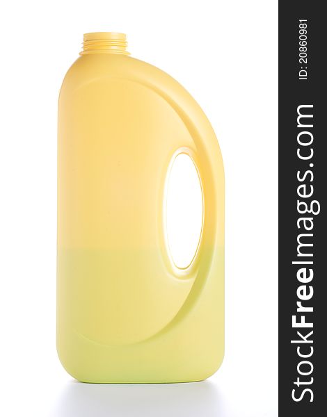 Yellow bottle of domestic cleaner isolated on white