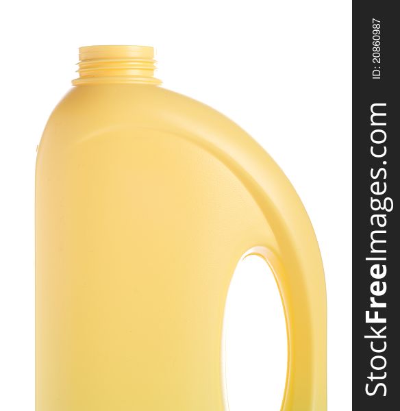 Yellow bottle of domestic cleaner isolated on white. Fragment