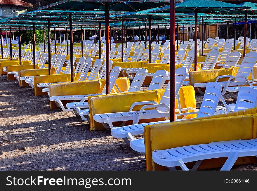 Perfect beach empty sunbeds and umbrellas. Perfect beach empty sunbeds and umbrellas