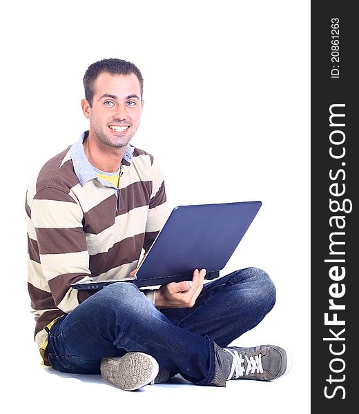 Young man sitting and using a laptop