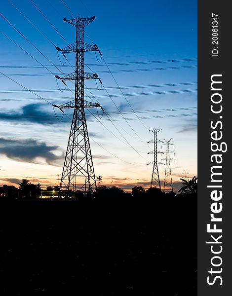 Electricity poles in twilight time in rural place