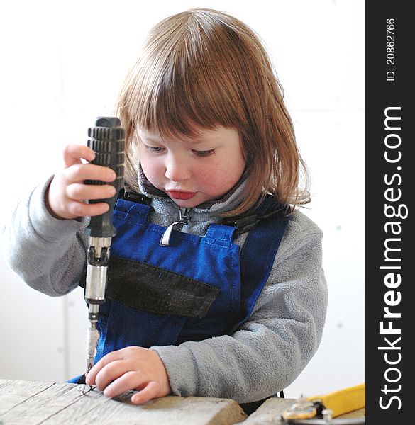 Little girl working with tools. Little girl working with tools