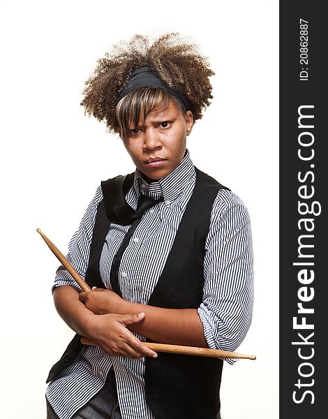 Young African girl poses with drumsticks against a white backgroundl. Young African girl poses with drumsticks against a white backgroundl