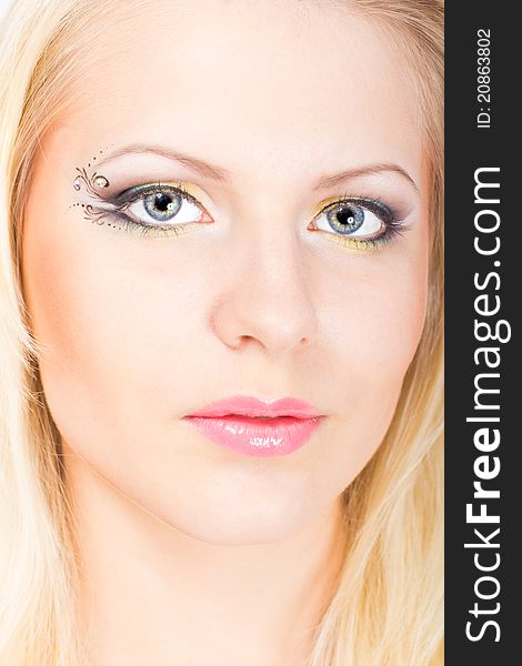 Close-up portrait of young beautiful blonde woman with stylish make-up