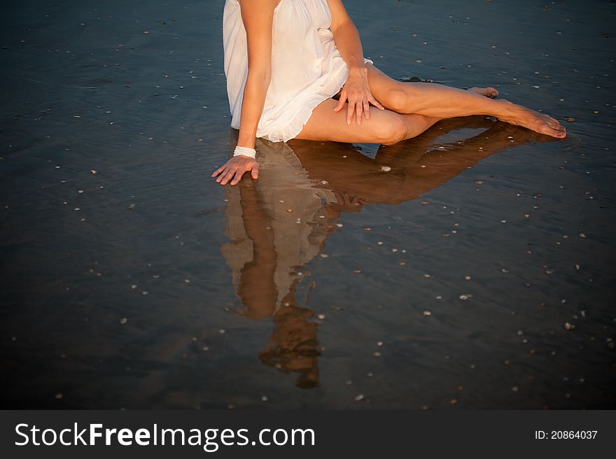 Sitting Woman In Water Mirror