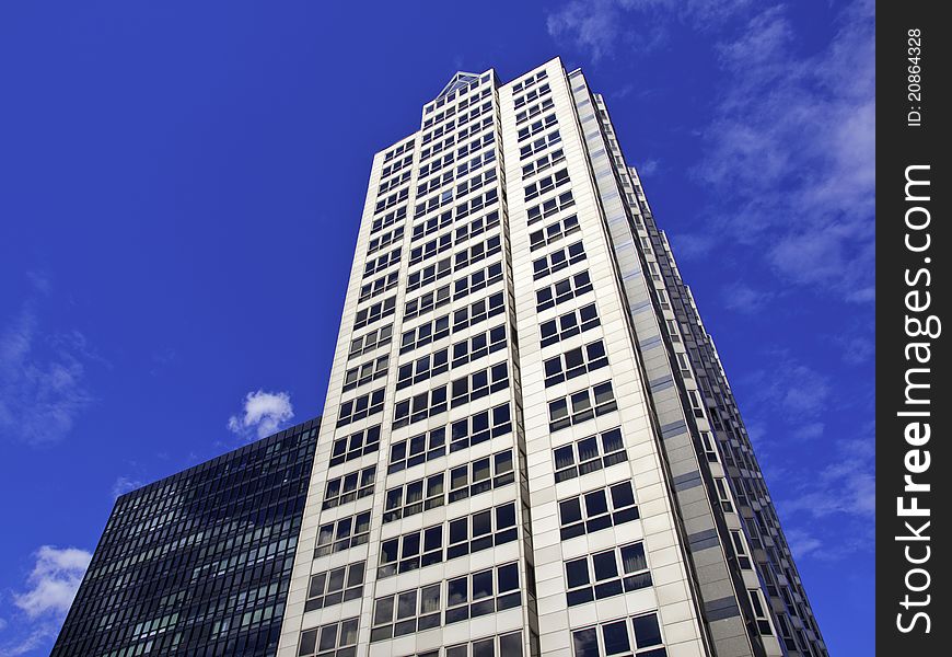 Modern Office Towers against a blue partly cloudy sky